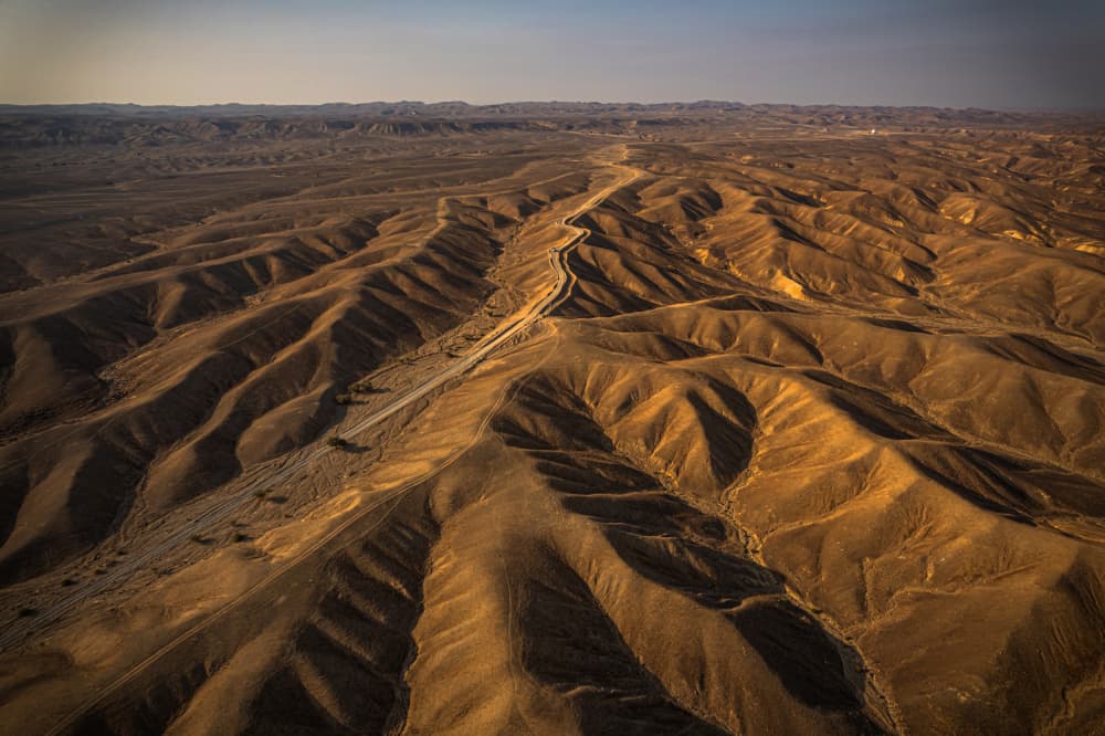 Golden Desert Road by Isam Telhami — canvas wall art
