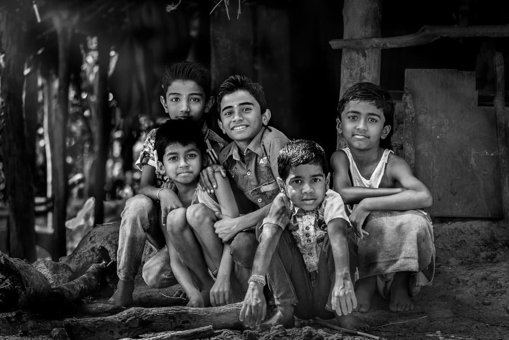 Young Boys' Smiles by Anita Singh — canvas wall art