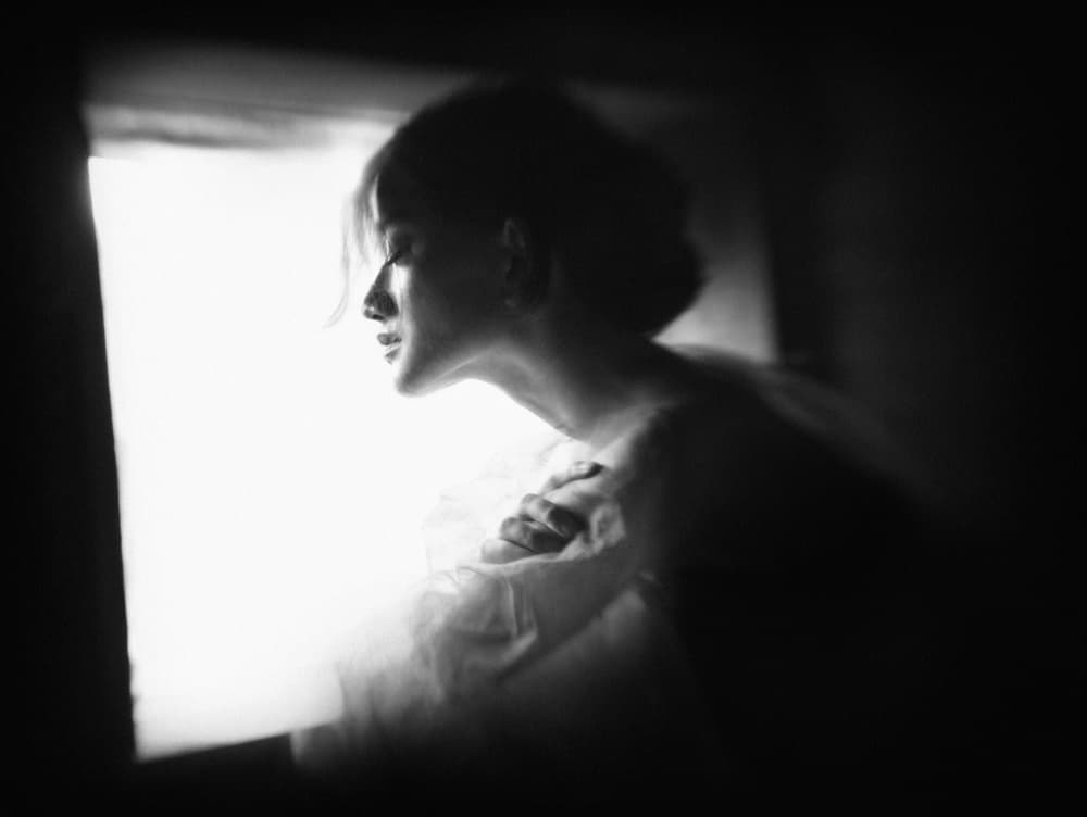 Serene Woman By Window by Sebastian Kisworo — canvas wall art