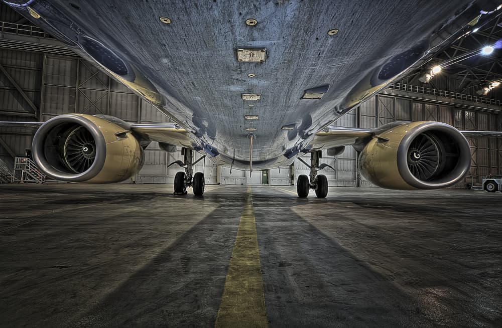 Massive Jet In Hangar by Rolf Lampert — canvas wall art