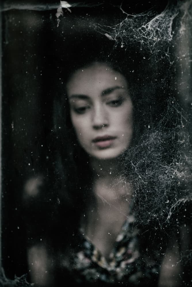 Woman Through Cobwebbed Glass by Jacob Tuinenga — canvas wall art