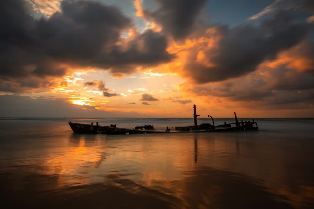 Shipwreck Sunset Reflection by Isam Telhami — canvas wall art