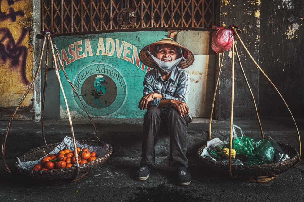 Smiling Street Vendor by Marco Tagliarino — canvas wall art