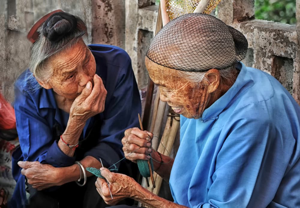 Asian Grandmothers Crafting by Lou Urlings — canvas wall art