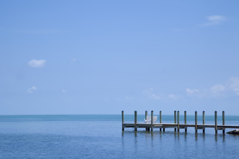 Blue Ocean Dock Chairs by Melanie Viola — canvas wall art