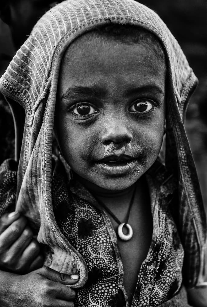Child's Soulful Gaze by Joxe Inazio Kuesta Garmendia — canvas wall art