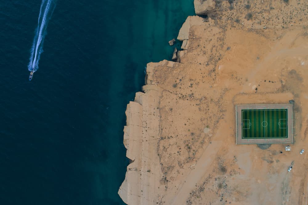 Green Pitch Desert Coast by Haitham AL Farsi — canvas wall art