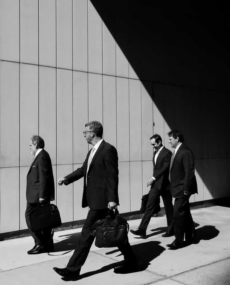 Businessmen Walking In Sunlight by Ivan Lesica — canvas wall art