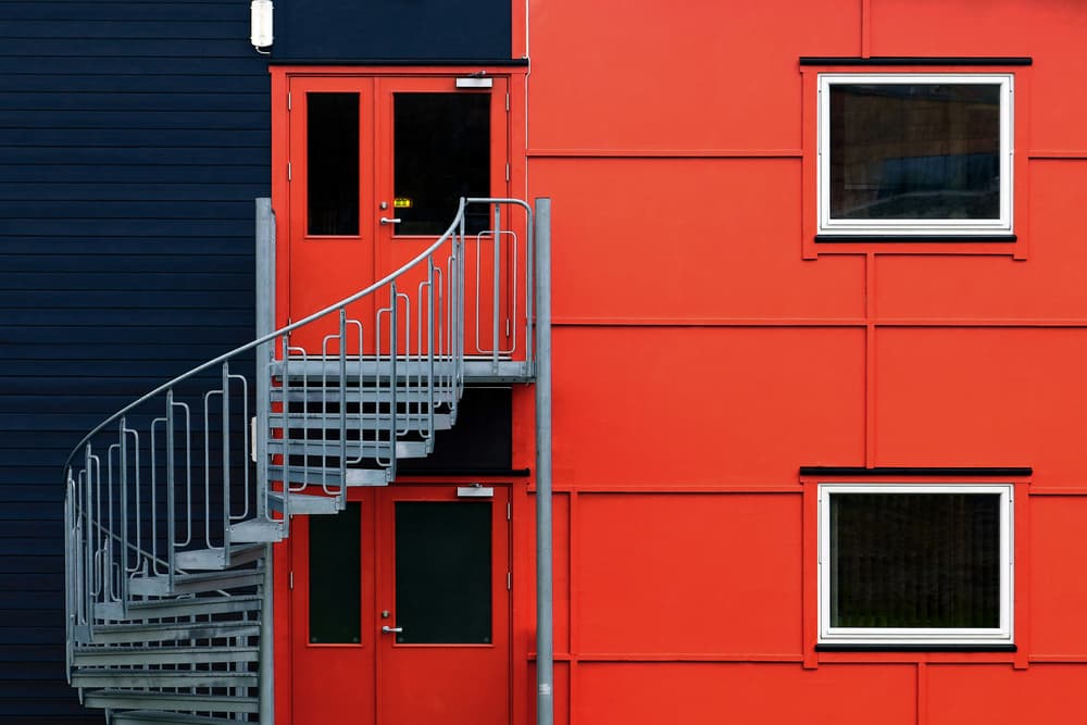 Red Building Spiral Stairs by Hans-Wolfgang Hawerkamp — canvas wall art