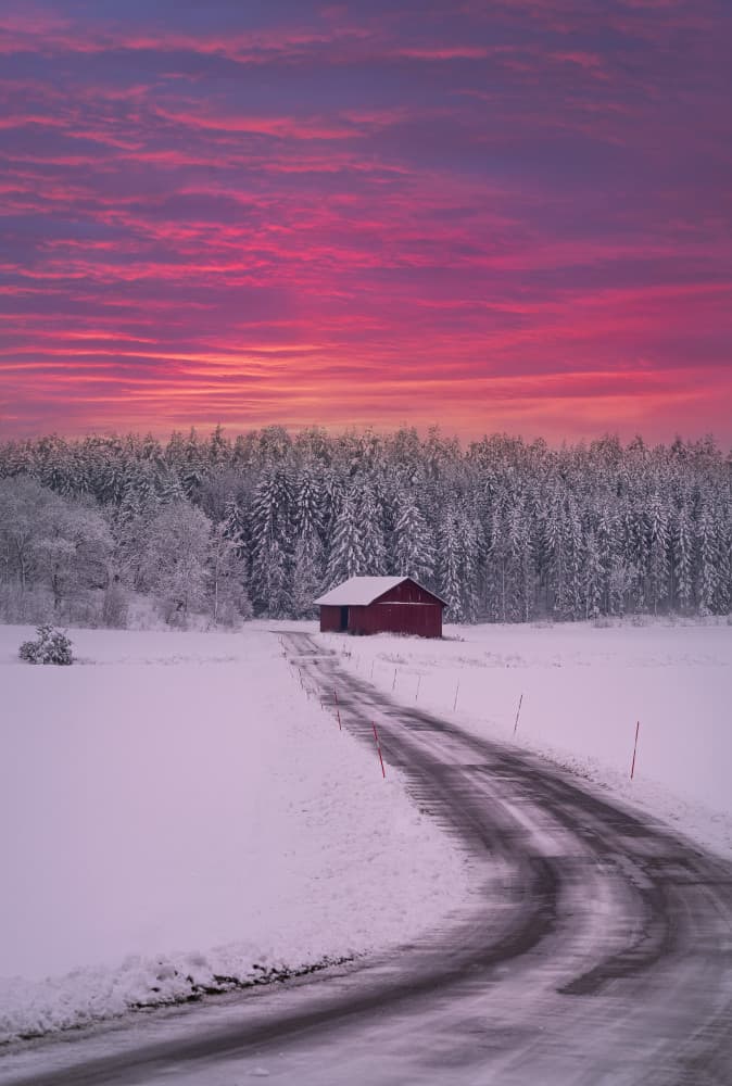 Winter Road Red Barn by Christian Lindsten — canvas wall art
