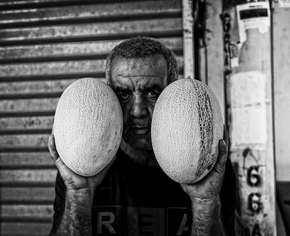 Intense Melon Vendor by Yuri Shepelev — canvas wall art