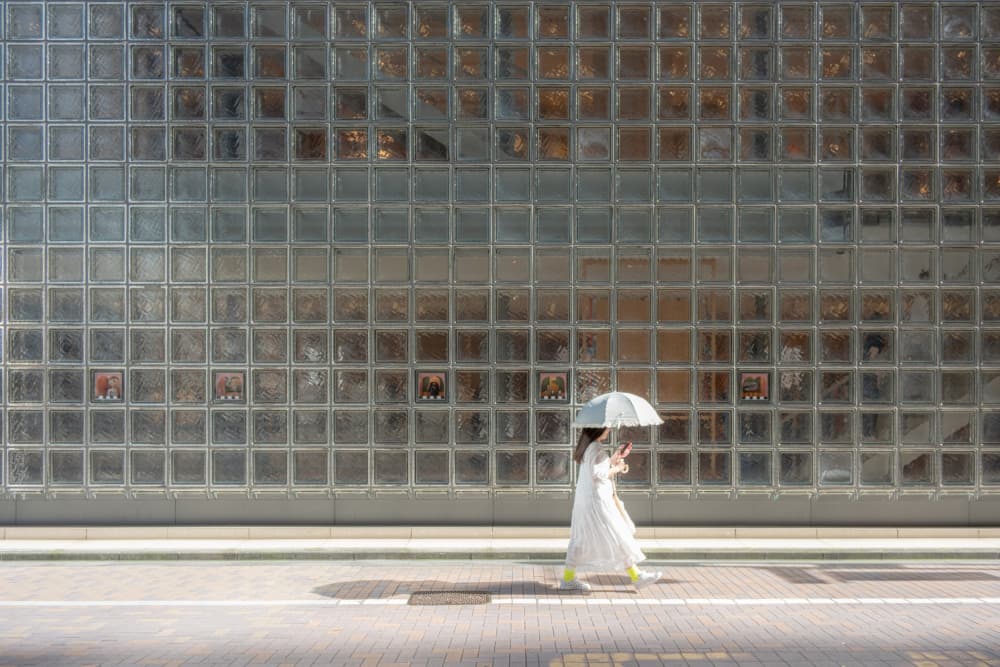 Woman By Glass Wall by Yohei Kawashima — canvas wall art