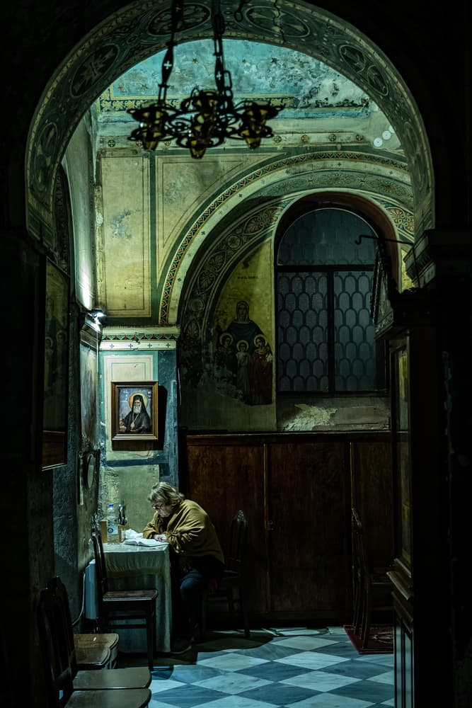 Man Reading Old Church by Serge Melesan — canvas wall art