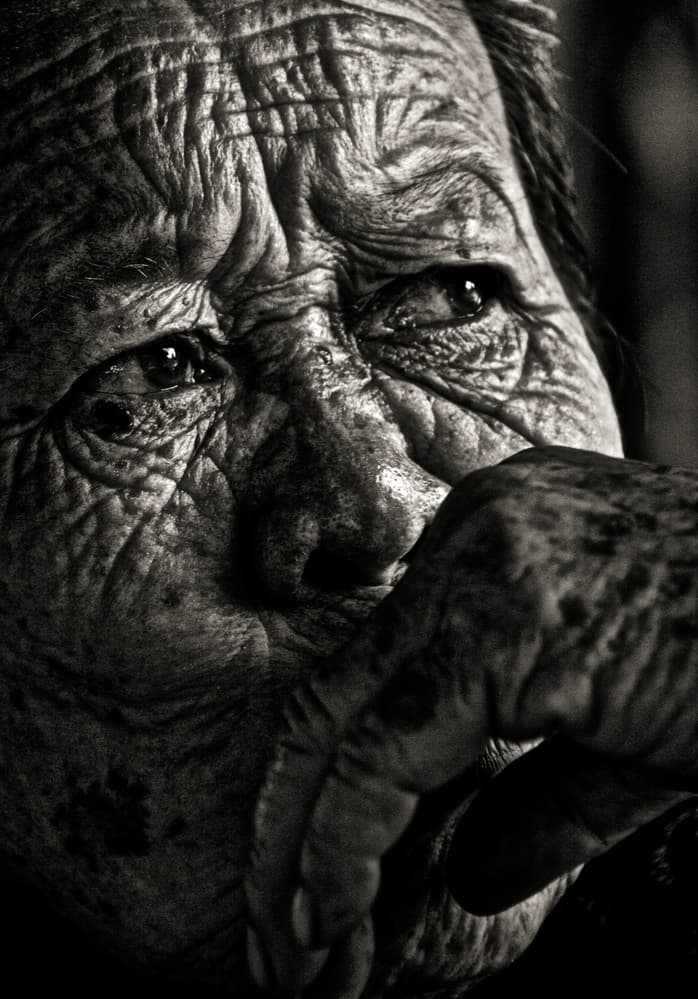 Aged Face Pensive Gaze by Erik Schottstaedt — canvas wall art