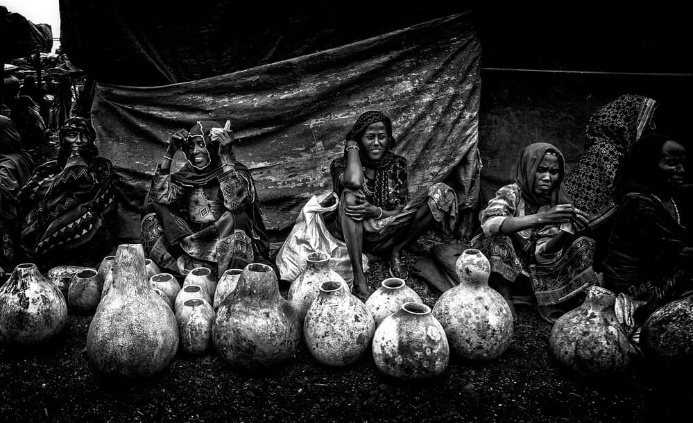 Market Women and Gourds by Joxe Inazio Kuesta Garmendia — canvas wall art