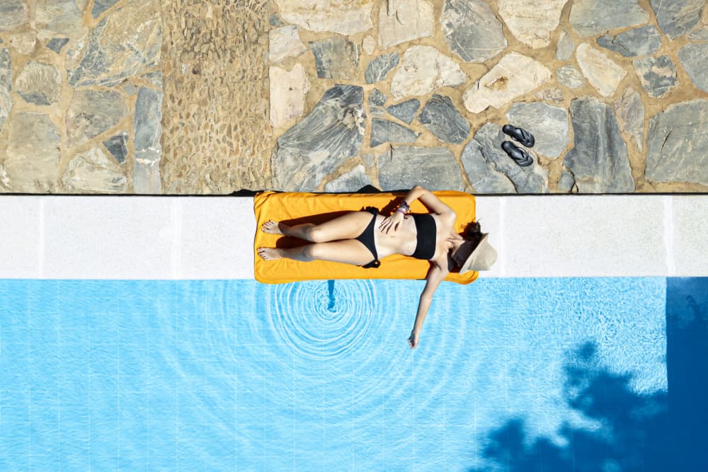Sunny Poolside Retreat by JUAN CARLOS HERVÁS MARTÍNEZ — canvas wall art