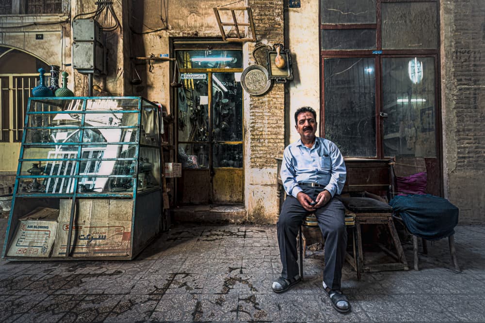 Smiling Man Old Shop by Marco Tagliarino — canvas wall art