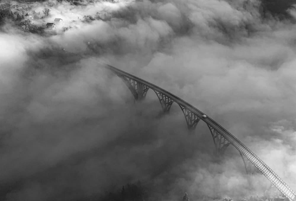 Misty Bridge Above Clouds by Radojica Jevric fotorax — canvas wall art