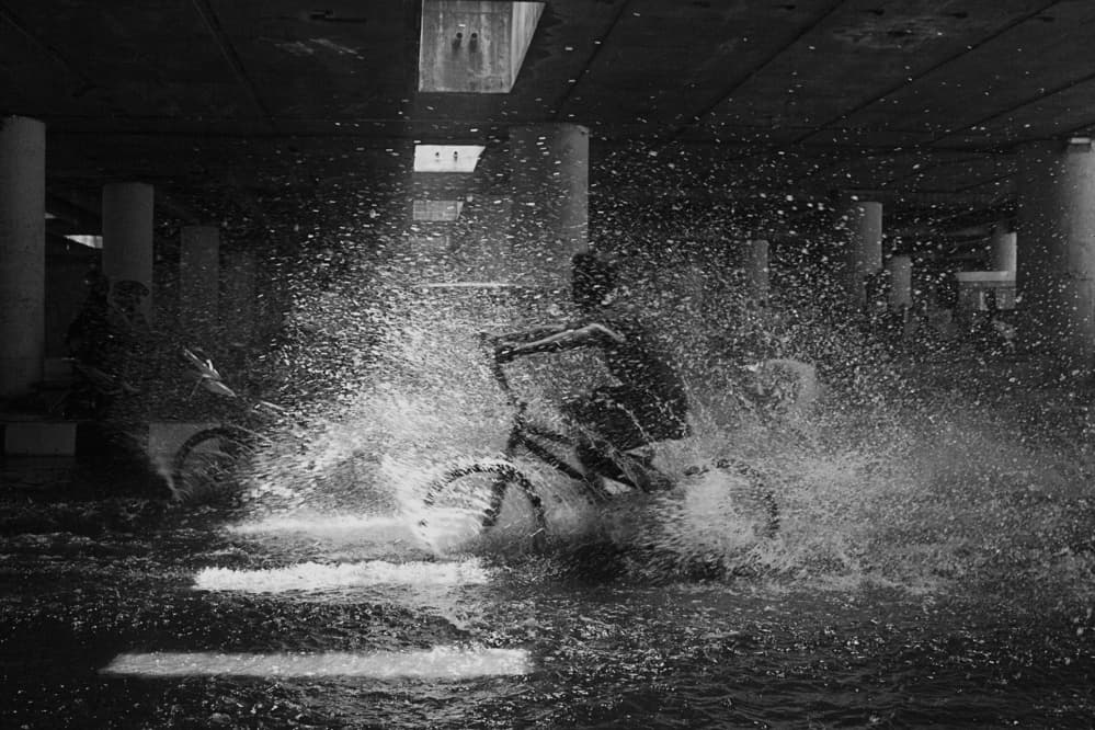 Biker Water Splash by Sebastian Kisworo — canvas wall art