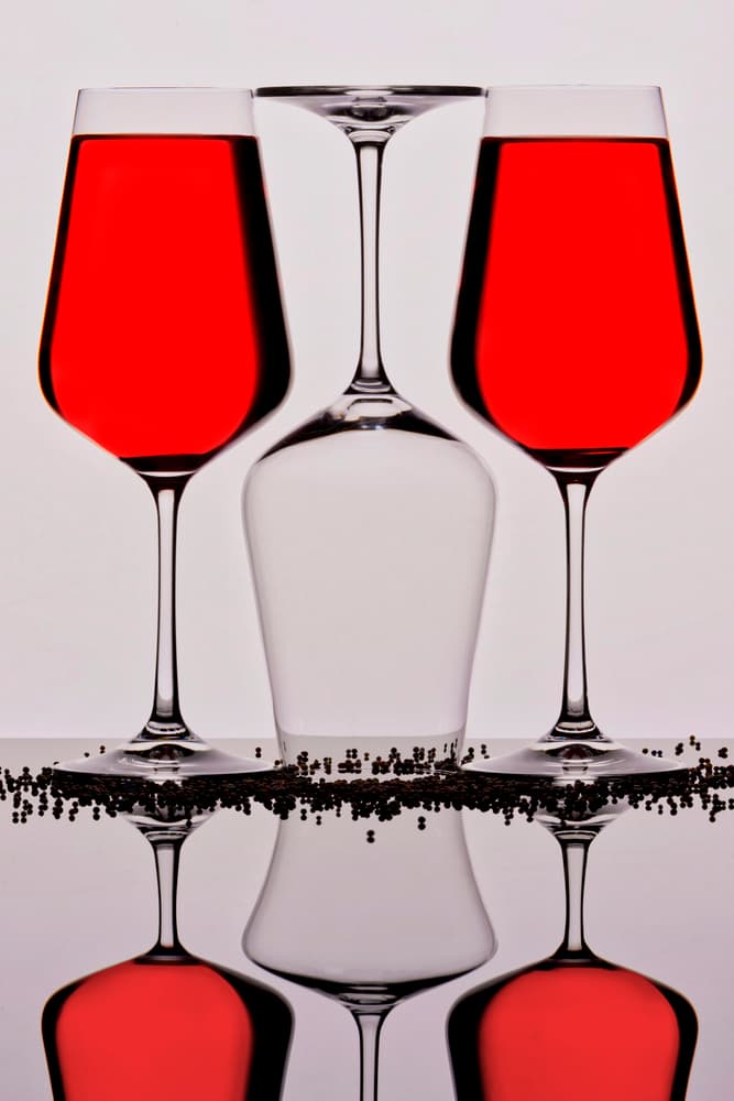 Red Wine Glass Reflection by Eyal Amer — canvas wall art