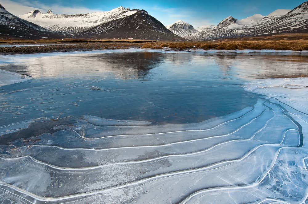 Frozen Lake Mountains by Piet Haaksma — canvas wall art