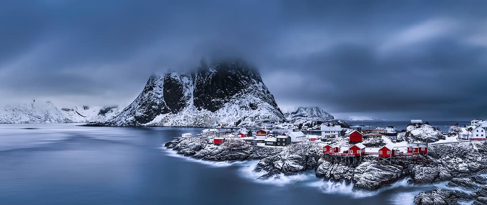 Red Cabins Winter Village by Jingshu Zhu — canvas wall art