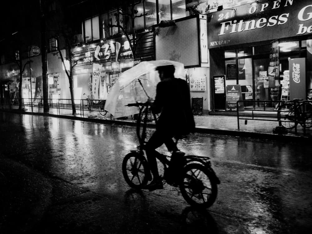 Rainy City Cyclist by Ryoga Otake — canvas wall art