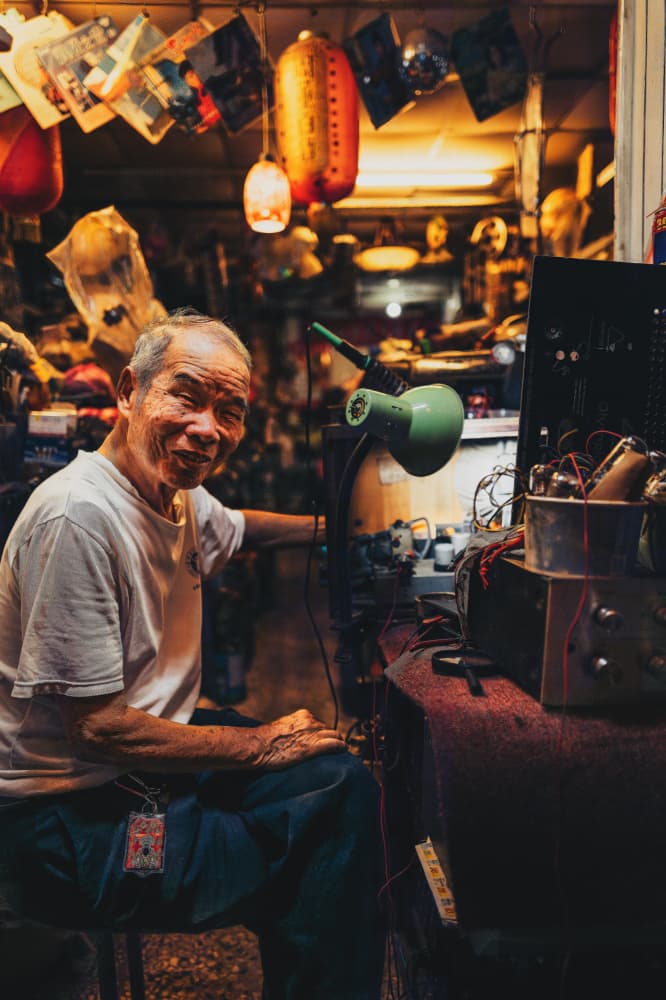 Smiling Shopkeeper at Work by Yuzo Fujii — canvas wall art