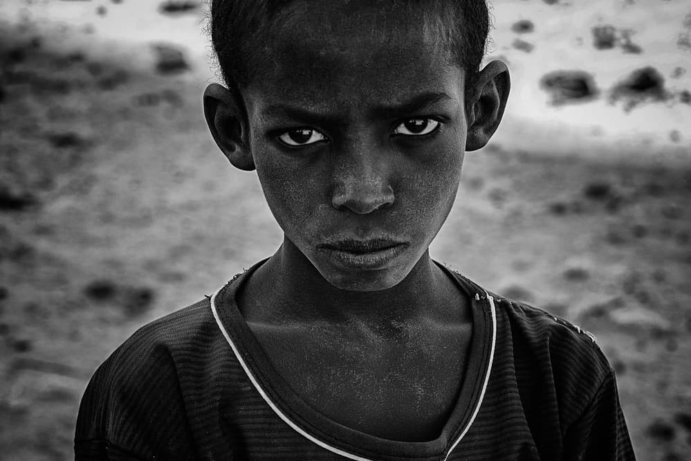 Intense Boy's Gaze by Joxe Inazio Kuesta Garmendia — canvas wall art