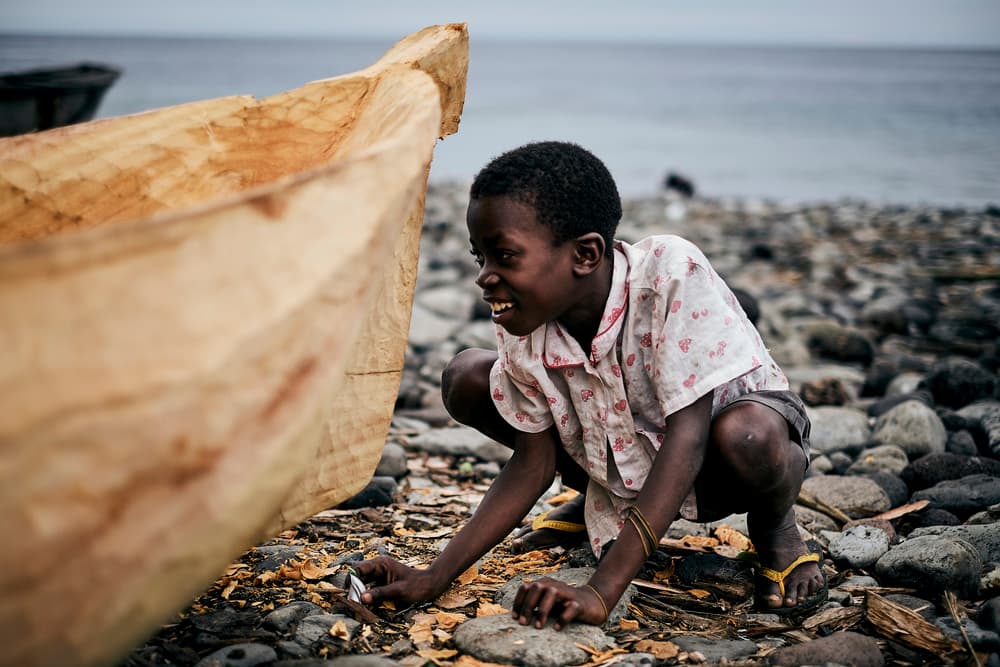 Joyful Boy and Canoe by Luís Godinho — canvas wall art