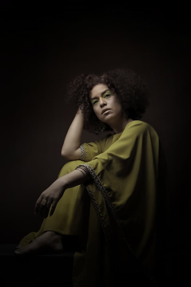 Pensive Woman in Green by Moein Hasheminasab — canvas wall art