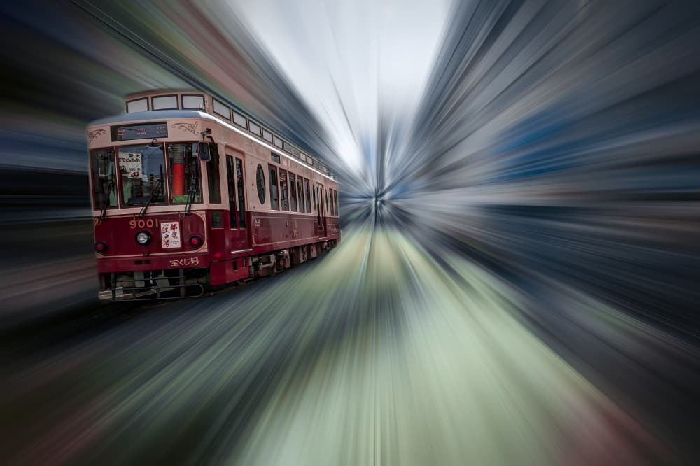 Red Tram in Motion by Tomoshi Hara — canvas wall art