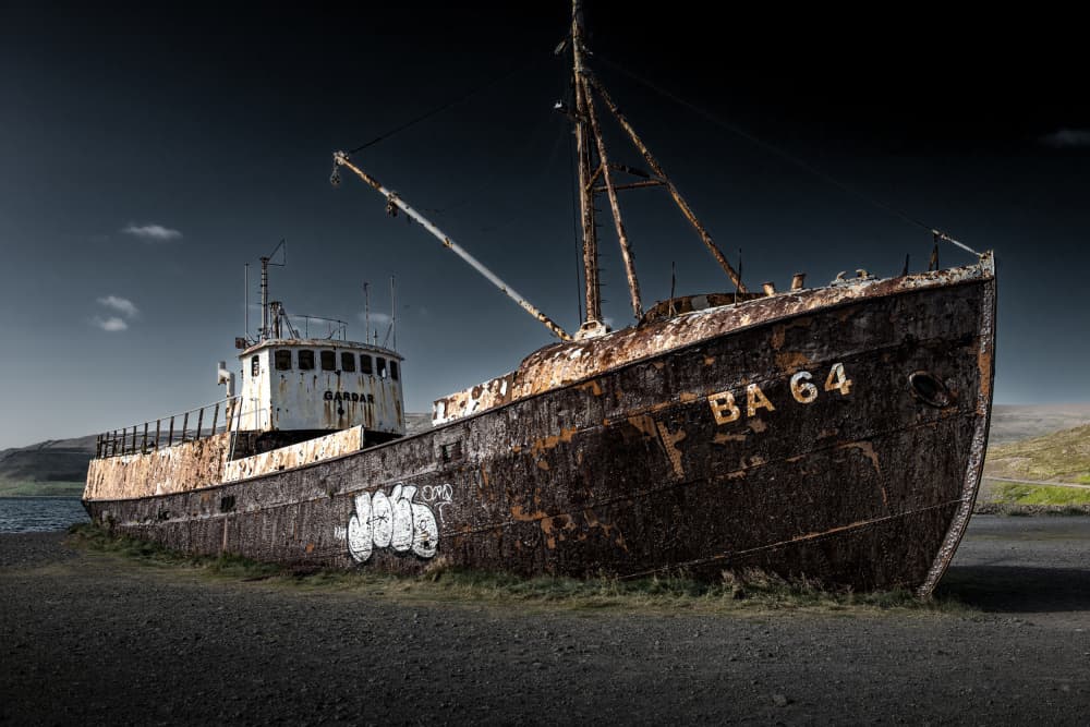 Rusty Shipwreck on Shore by Andrea Auf dem Brinke — canvas wall art