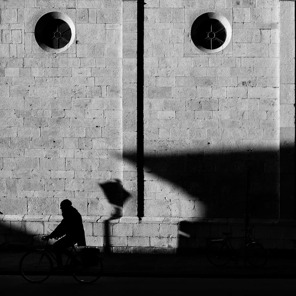 Urban Cyclist Silhouette by Massimo Della Latta — canvas wall art
