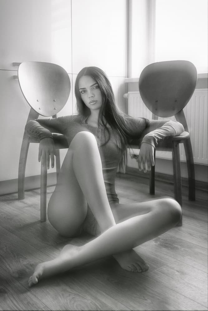 Pensive Woman With Chairs by Ruslan Bolgov — canvas wall art