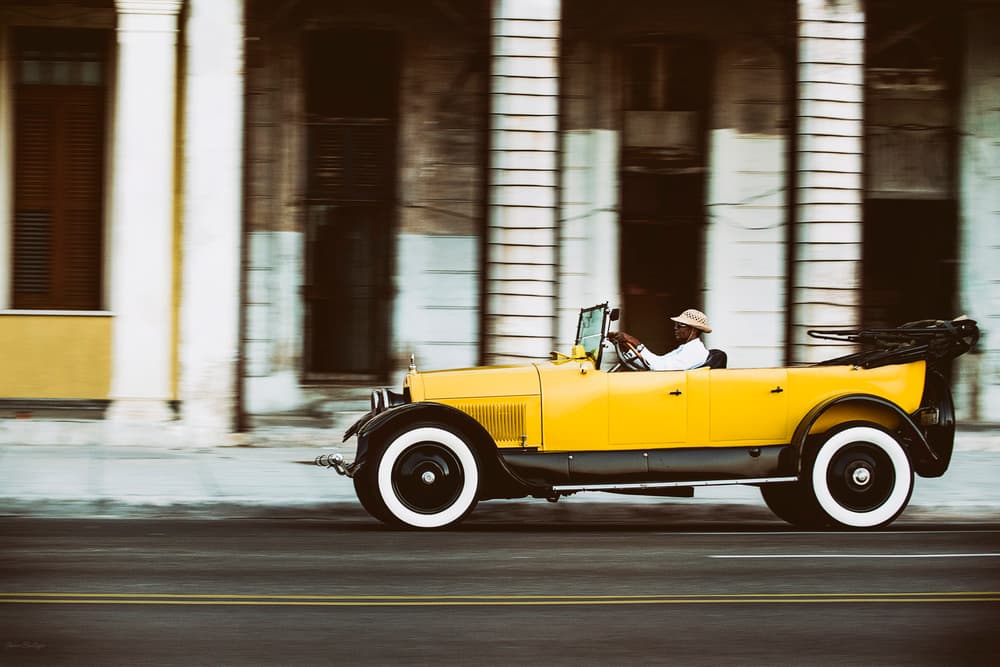 Yellow Vintage Car Cruise by Gina Buliga — canvas wall art
