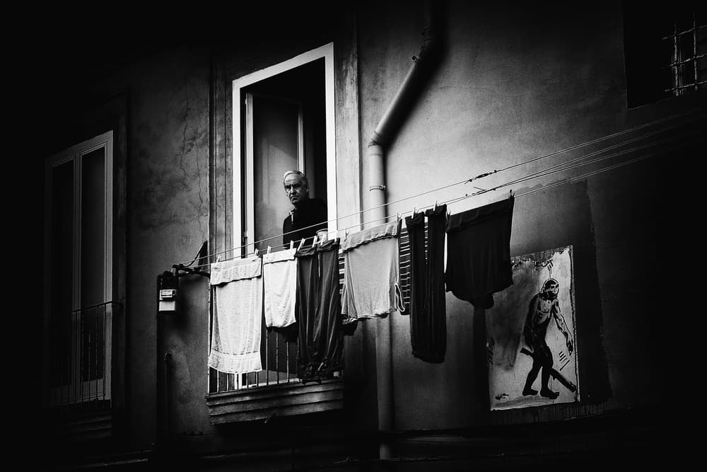 Man In City Window by Antonio Grambone — canvas wall art