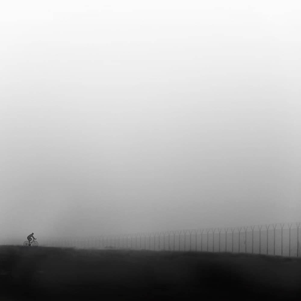 Cyclist In The Fog by George Digalakis — canvas wall art