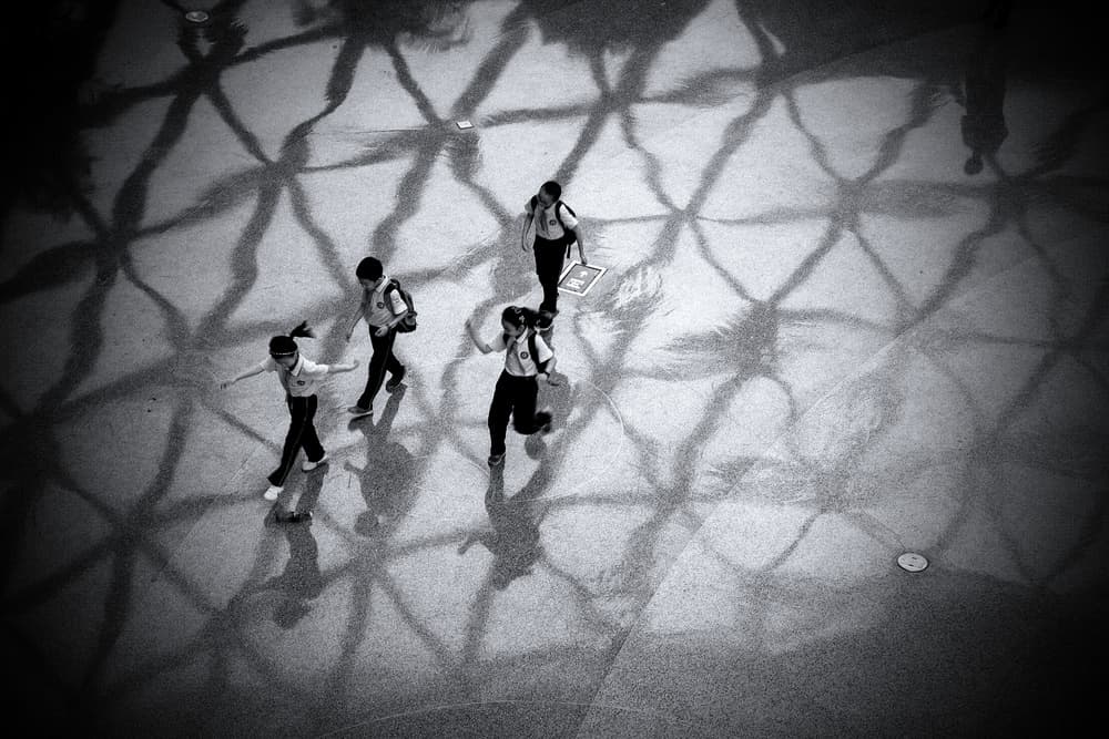 Kids and Geometric Shadows by Roberto Parola — canvas wall art