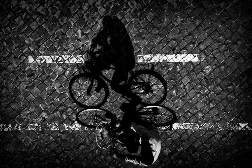 Cyclist Shadow Reflection by Antonio Grambone — canvas wall art