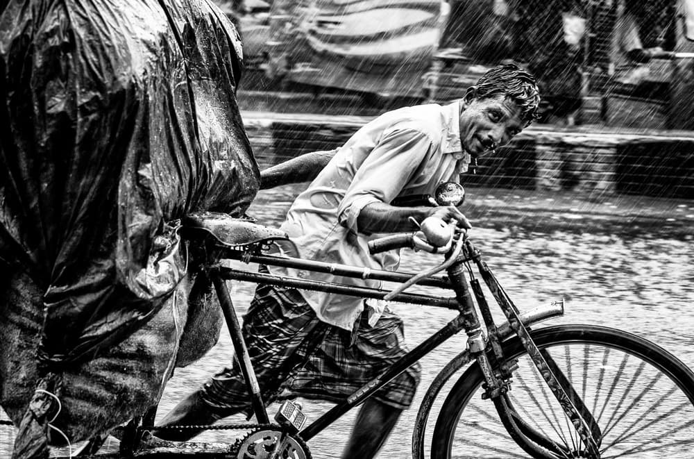 Man Pushing Through Rain by Joxe Inazio Kuesta Garmendia — canvas wall art