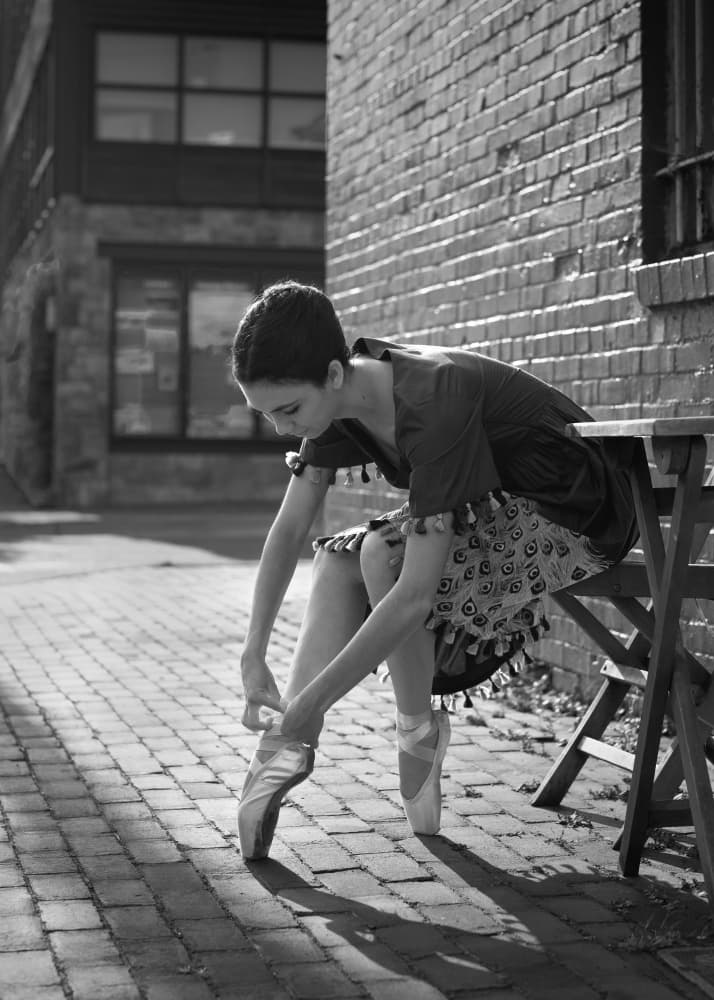 Street Ballerina Tying Shoes by Ruiqing P. — canvas wall art