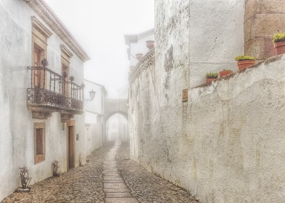 Misty Old Town Street by Lucie Gagnon — canvas wall art