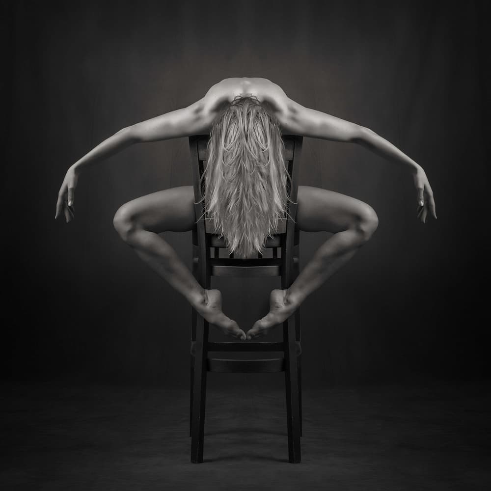 Flexible Figure On Chair by Catchlight Studio — canvas wall art