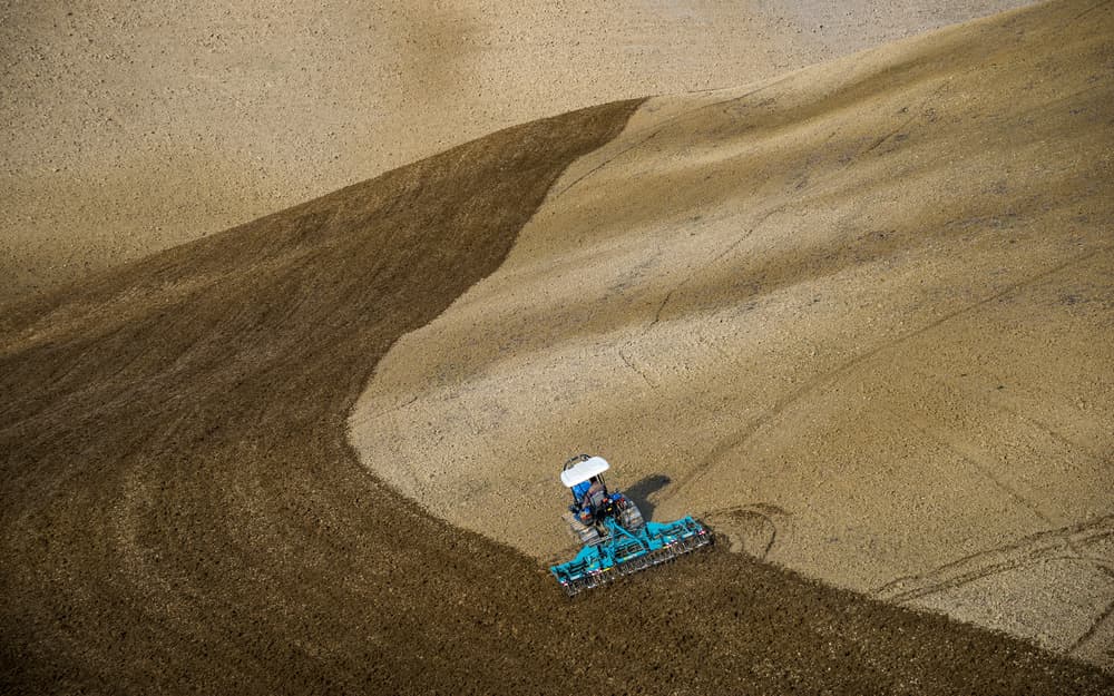 Tractor Plowing Field by Riccardo Lucidi — canvas wall art