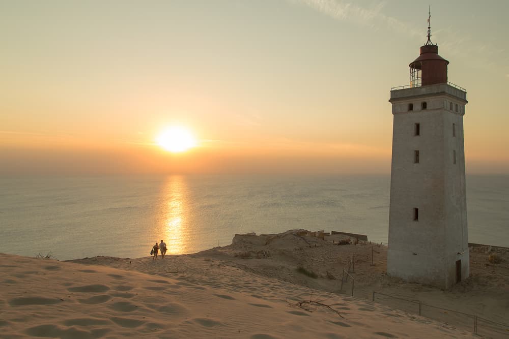Lighthouse Sunset Couple by Leif Løndal — canvas wall art