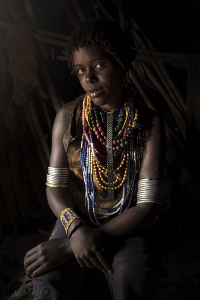 African Woman Beaded Portrait by Sarawut Intarob — canvas wall art