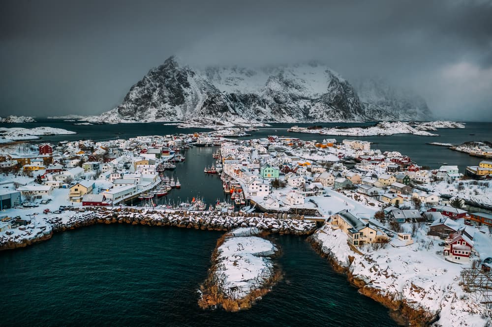 Snowy Nordic Coastal Village by Adrian Popan — canvas wall art