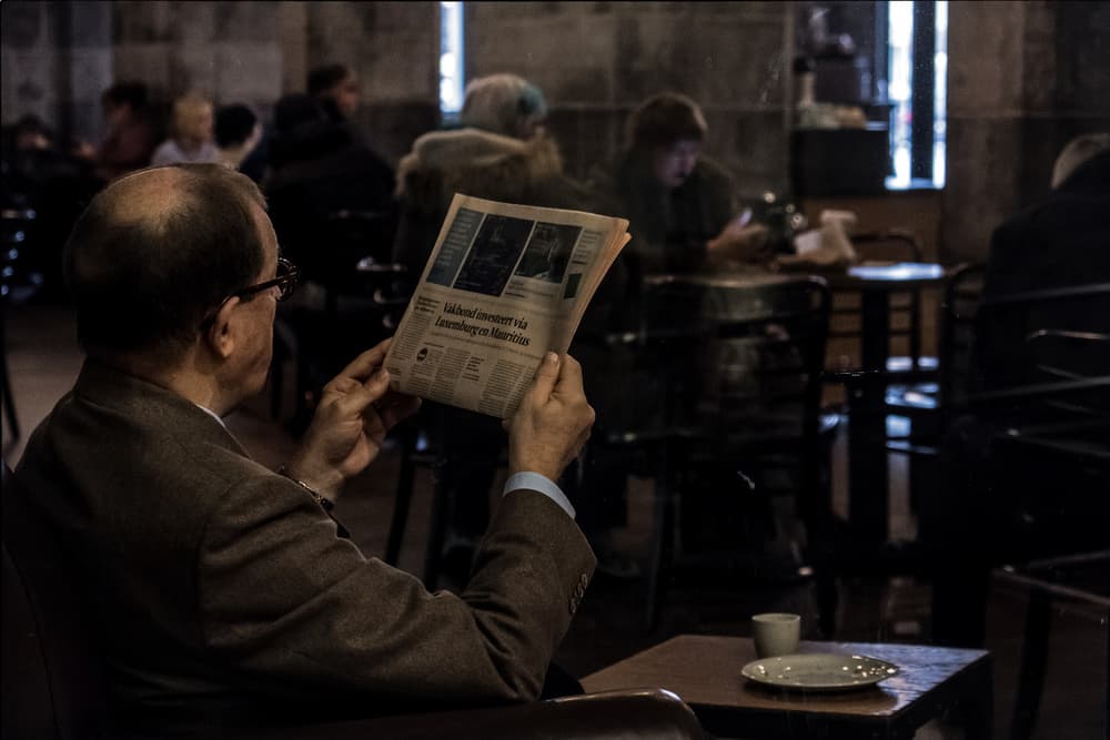 newspaper man by Lus Joosten — canvas wall art