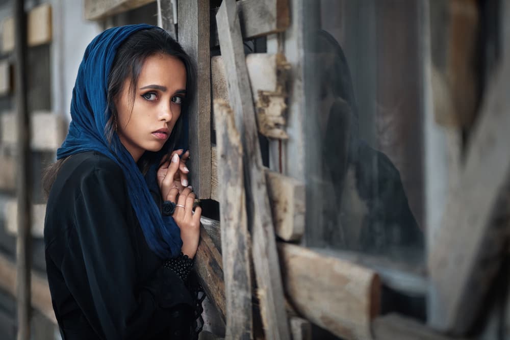 Pensive Woman Blue Headscarf by Boris Belokonov — canvas wall art